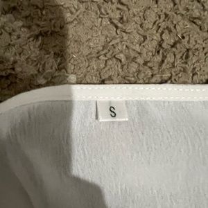 white dress size small, fits more like a medium